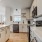 Modern kitchen with stainless steel appliances and quartz countertops