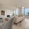 Dining Area and Living Room with Fireplace, Hardwood Style Flooring and Large Windows