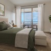 a bedroom with a large widow