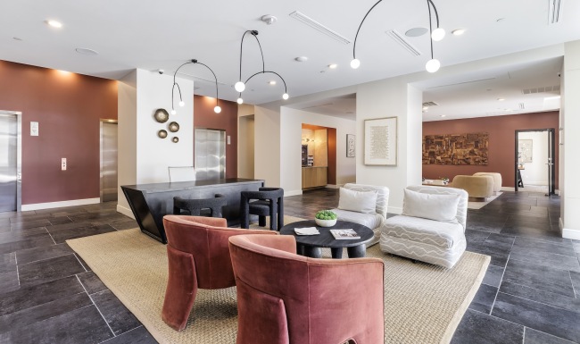 a front desk area with tables and chairs