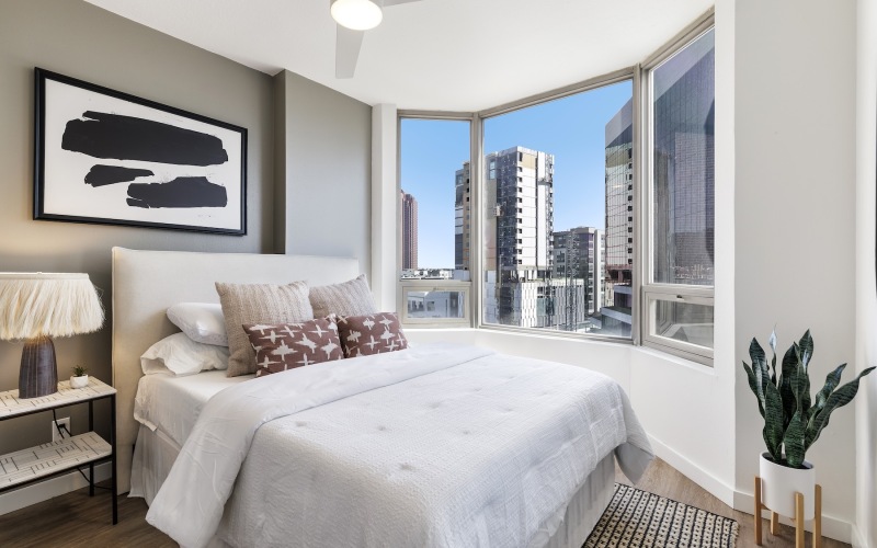 a bedroom with a bed and a nightstand